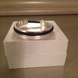 silver bracelet that holds your hair tie